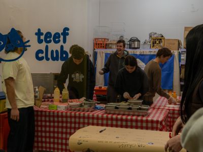 Young people making sandwiches at Say Cheese cafe